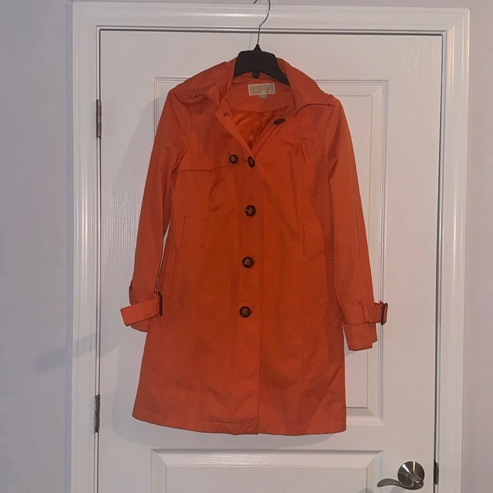 Michael Kors orange trench coat. Size small. Water resistant. Missing belt.